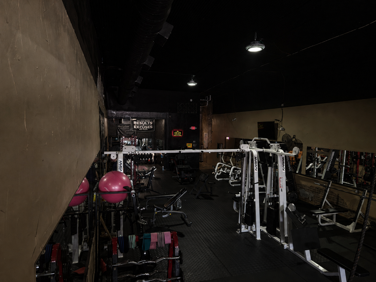 Gym floor with cable stacks and racks